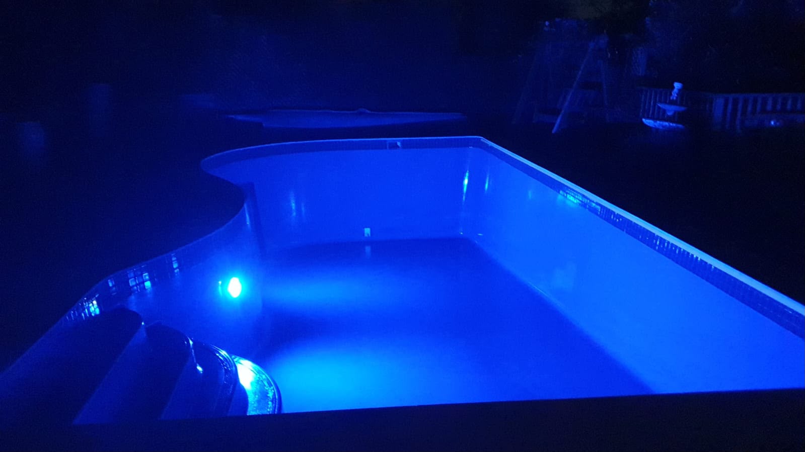 Pool lit at night by the new underwater lighting